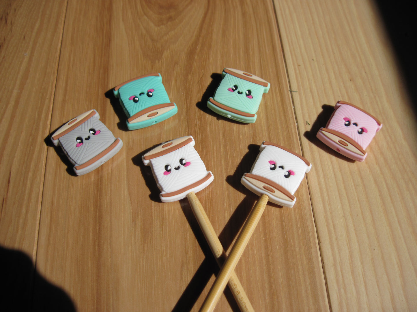 Spool of yarn stitch stoppers