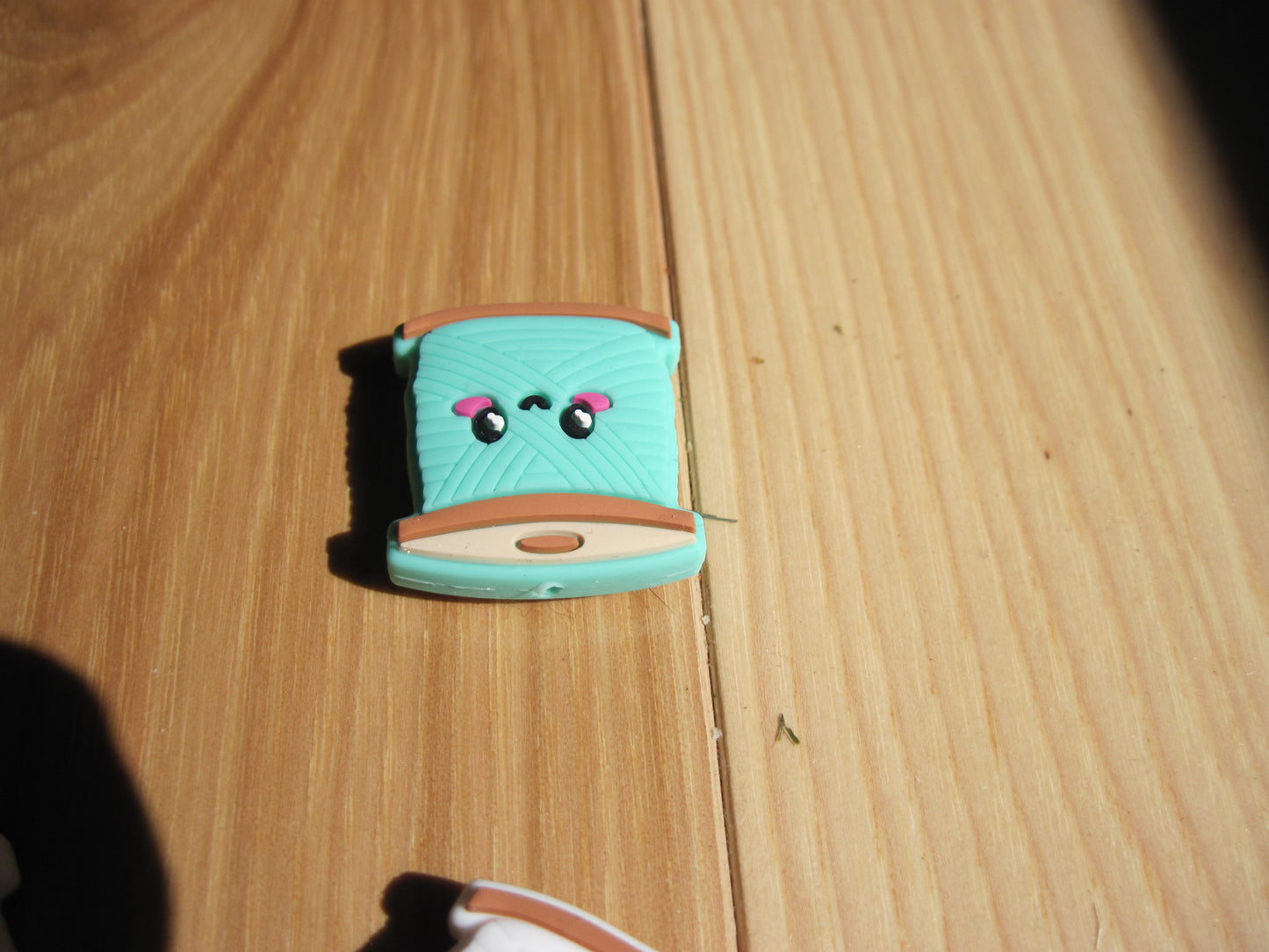 Spool of yarn stitch stoppers