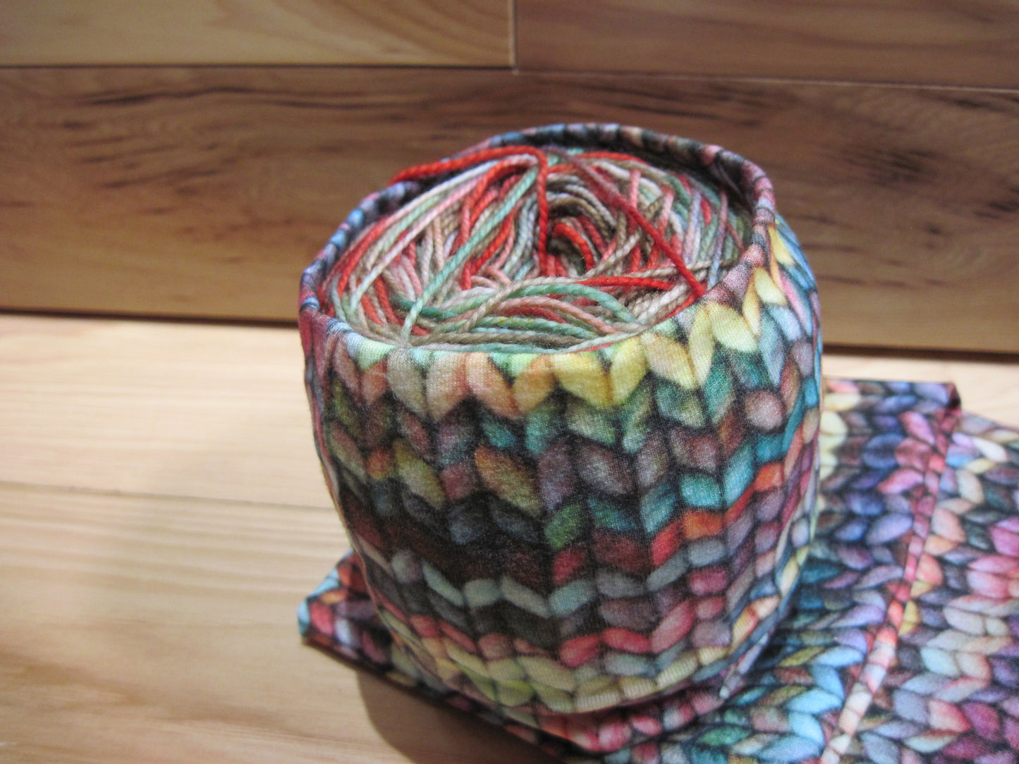Skein/Yarn cozie with multicolored knit stitches